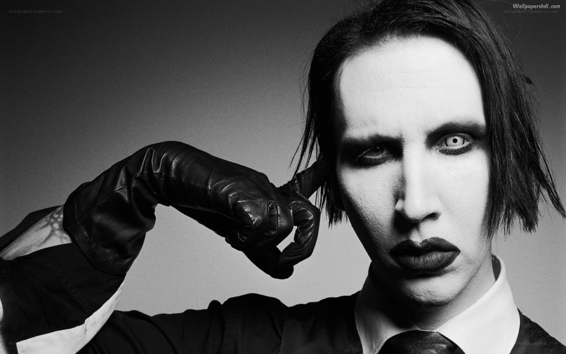 Man with dramatic makeup and leather glove