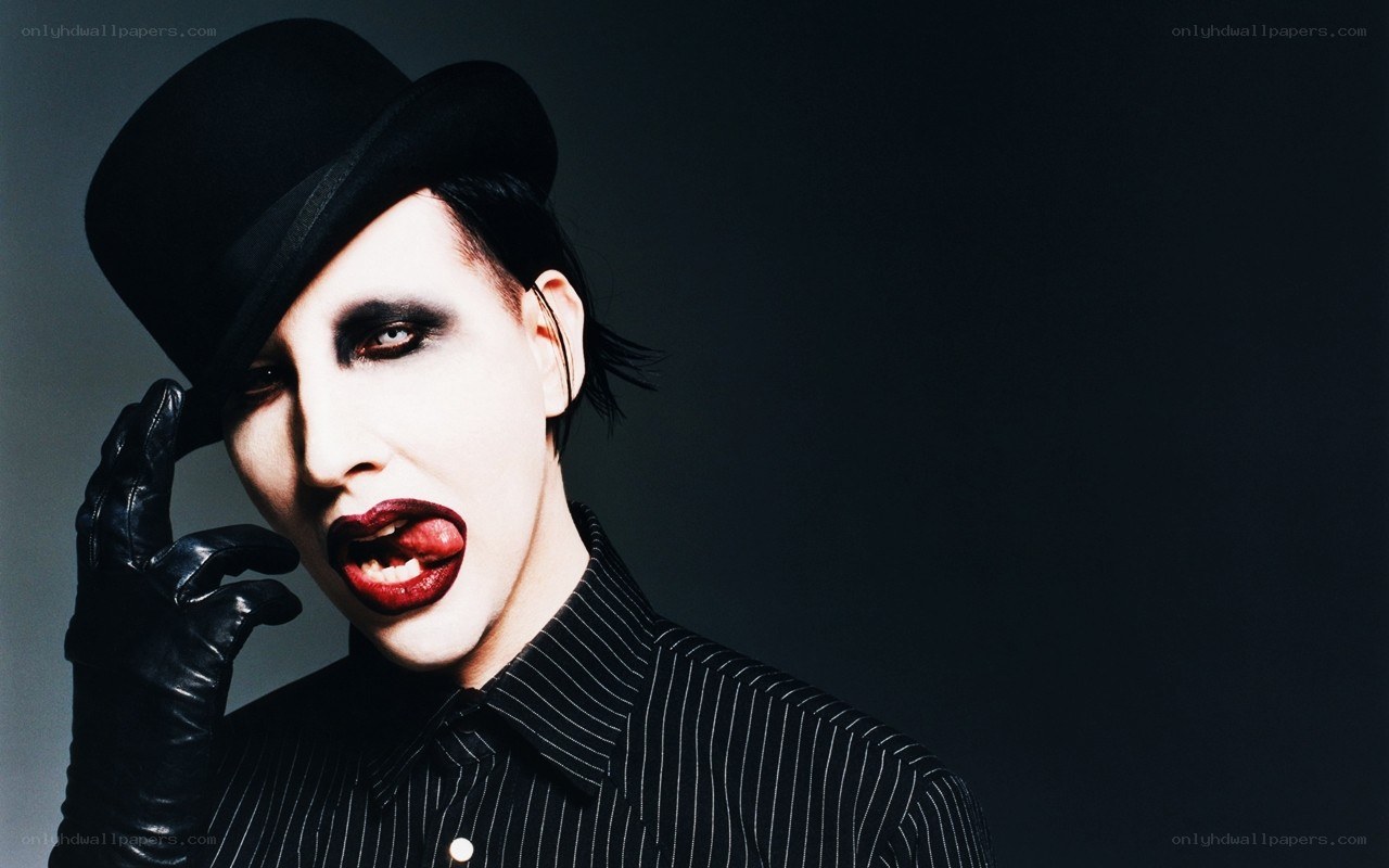 Man with dramatic makeup and top hat