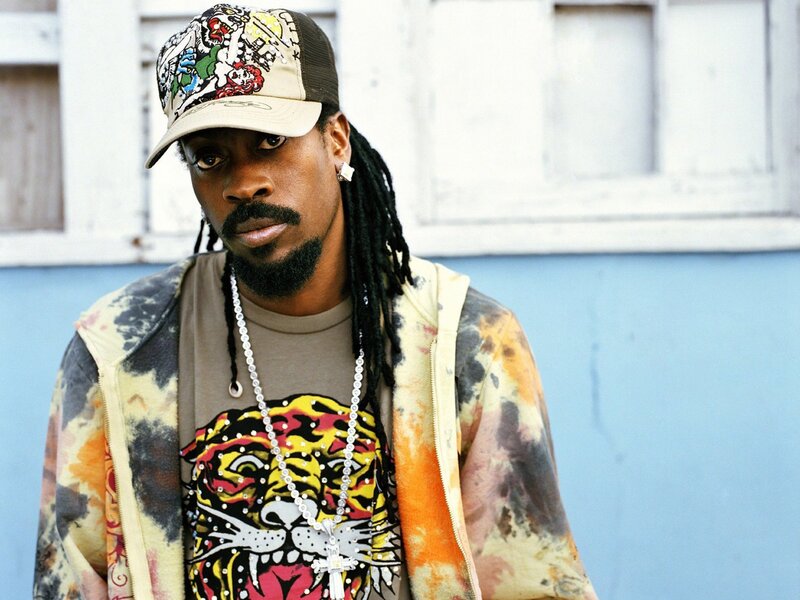 man with dreadlocks and cap