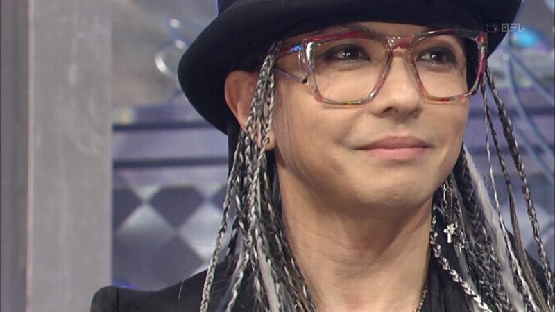 Man with Dreadlocks and Glasses