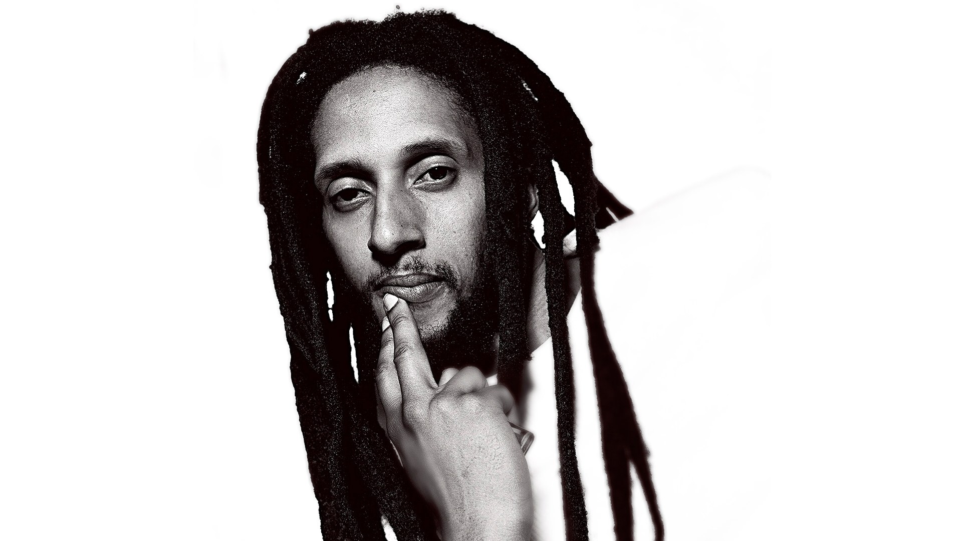 man with dreadlocks in black and white