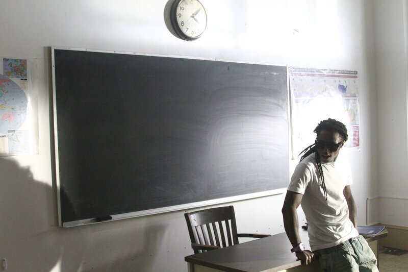 Man with Dreadlocks in Classroom