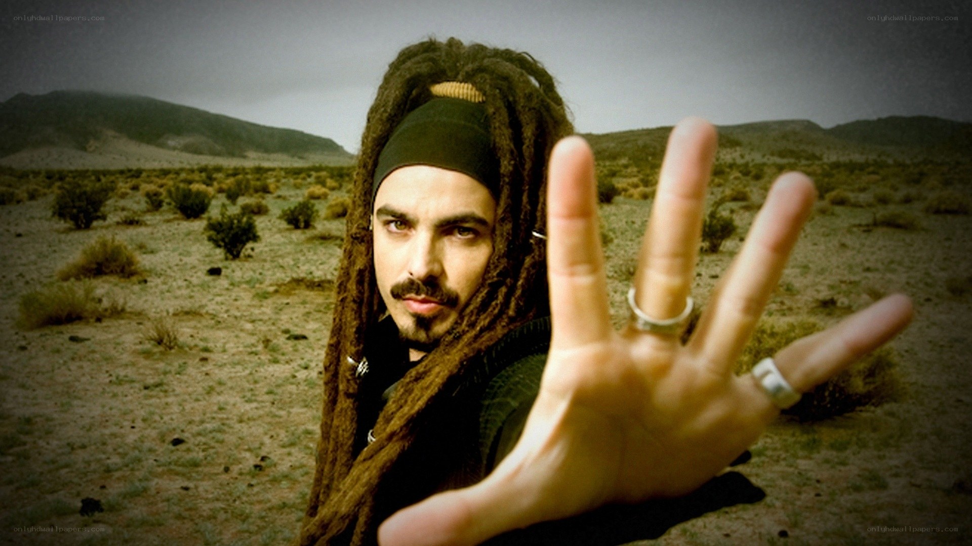 man with dreadlocks in desert