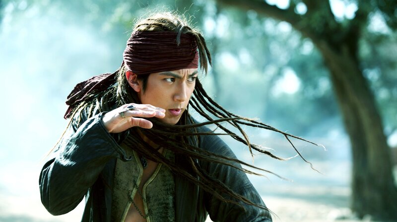 man with dreadlocks in forest