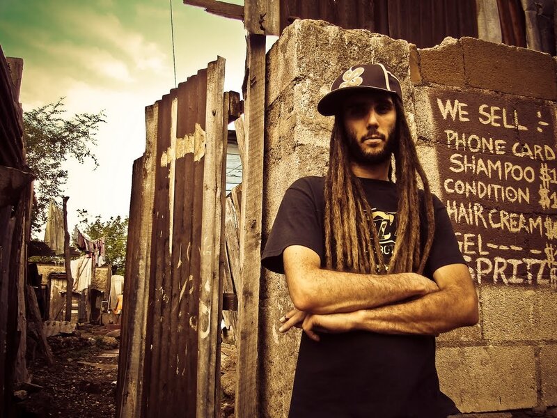 man with dreadlocks in urban setting