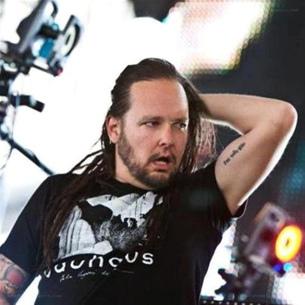 man with dreadlocks on stage