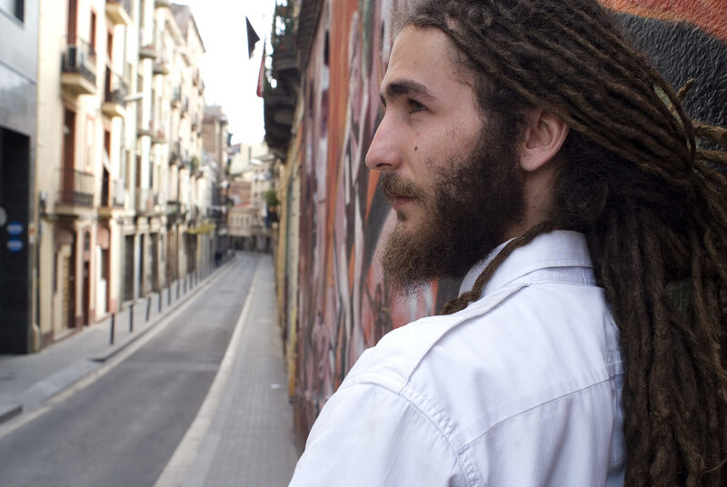 man with dreadlocks on street