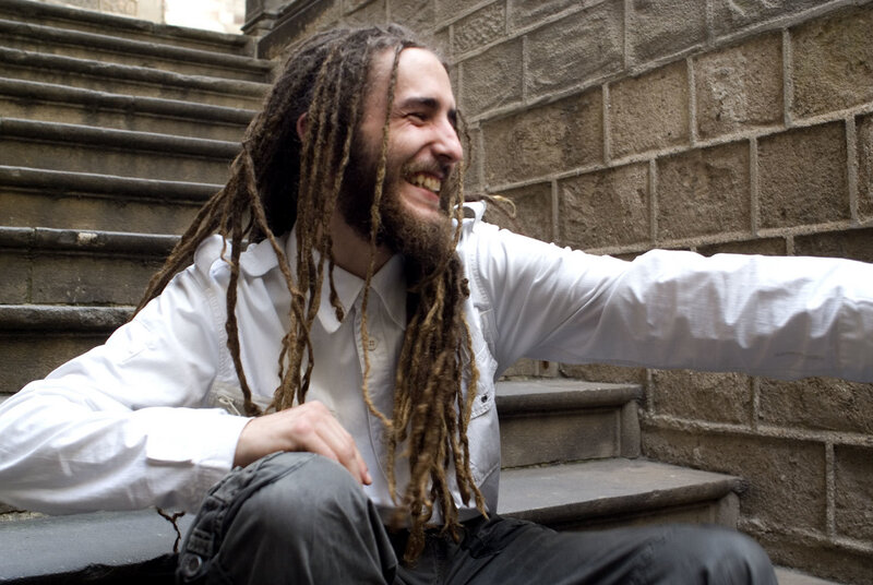 man with dreadlocks smiling