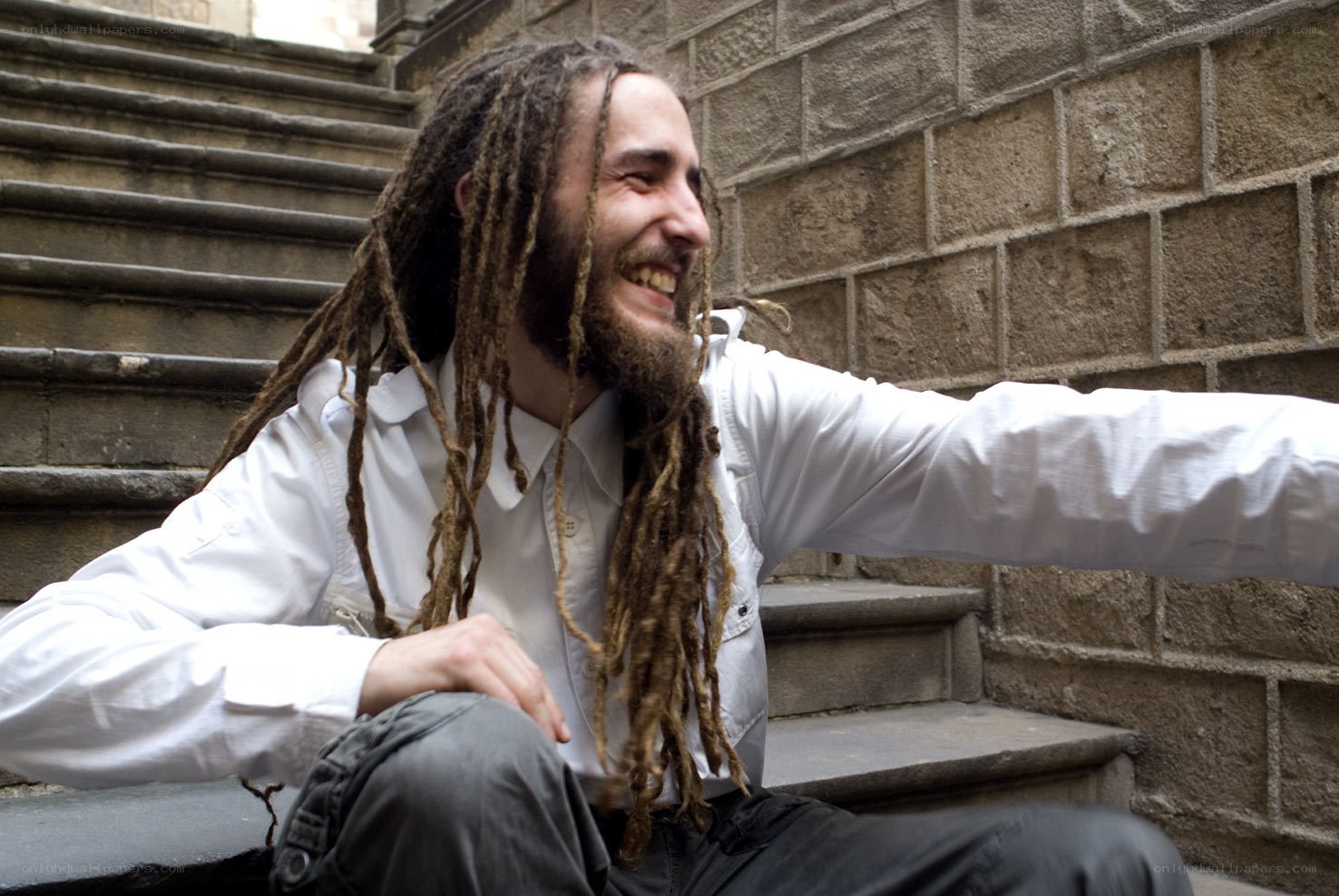 man with dreadlocks smiling