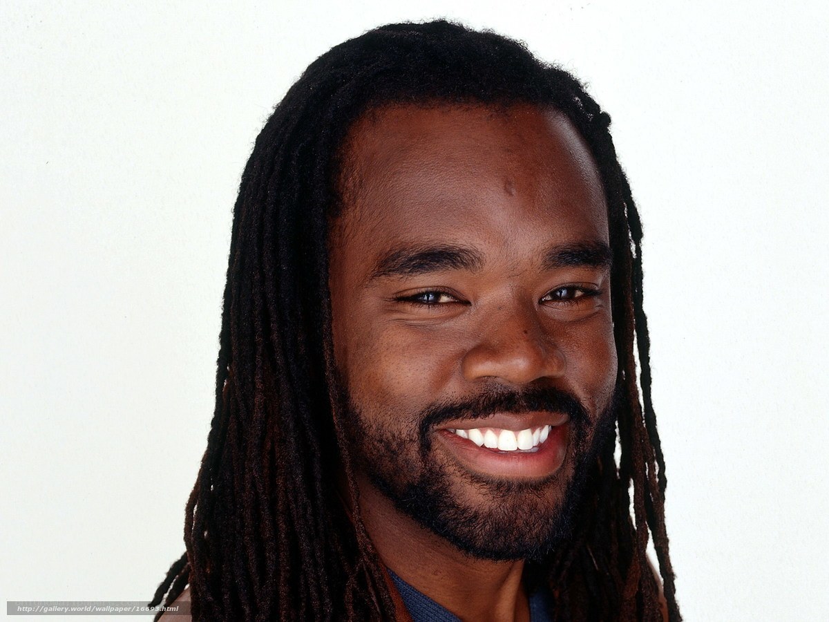 man with dreadlocks smiling