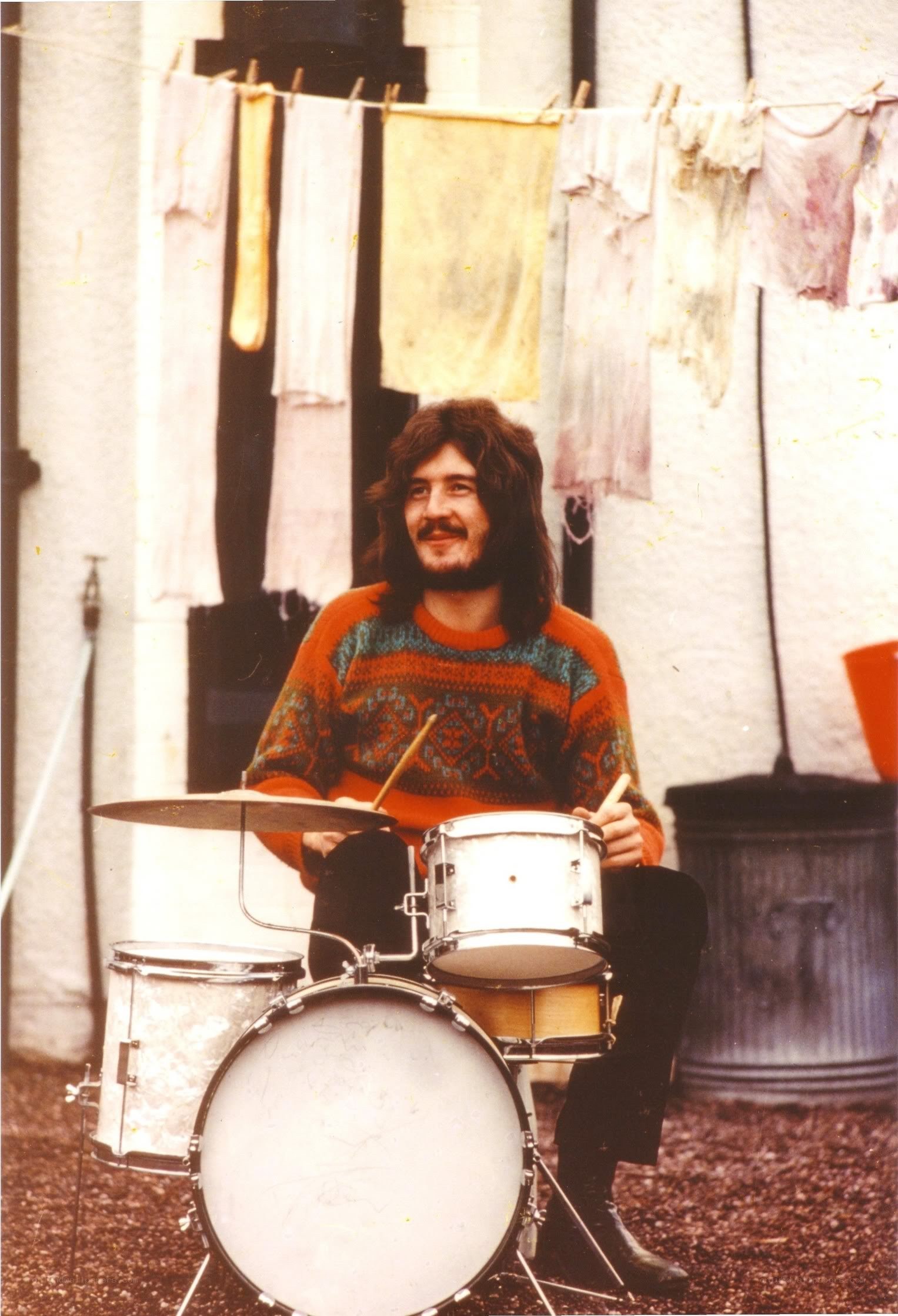 Man with drum set outdoors