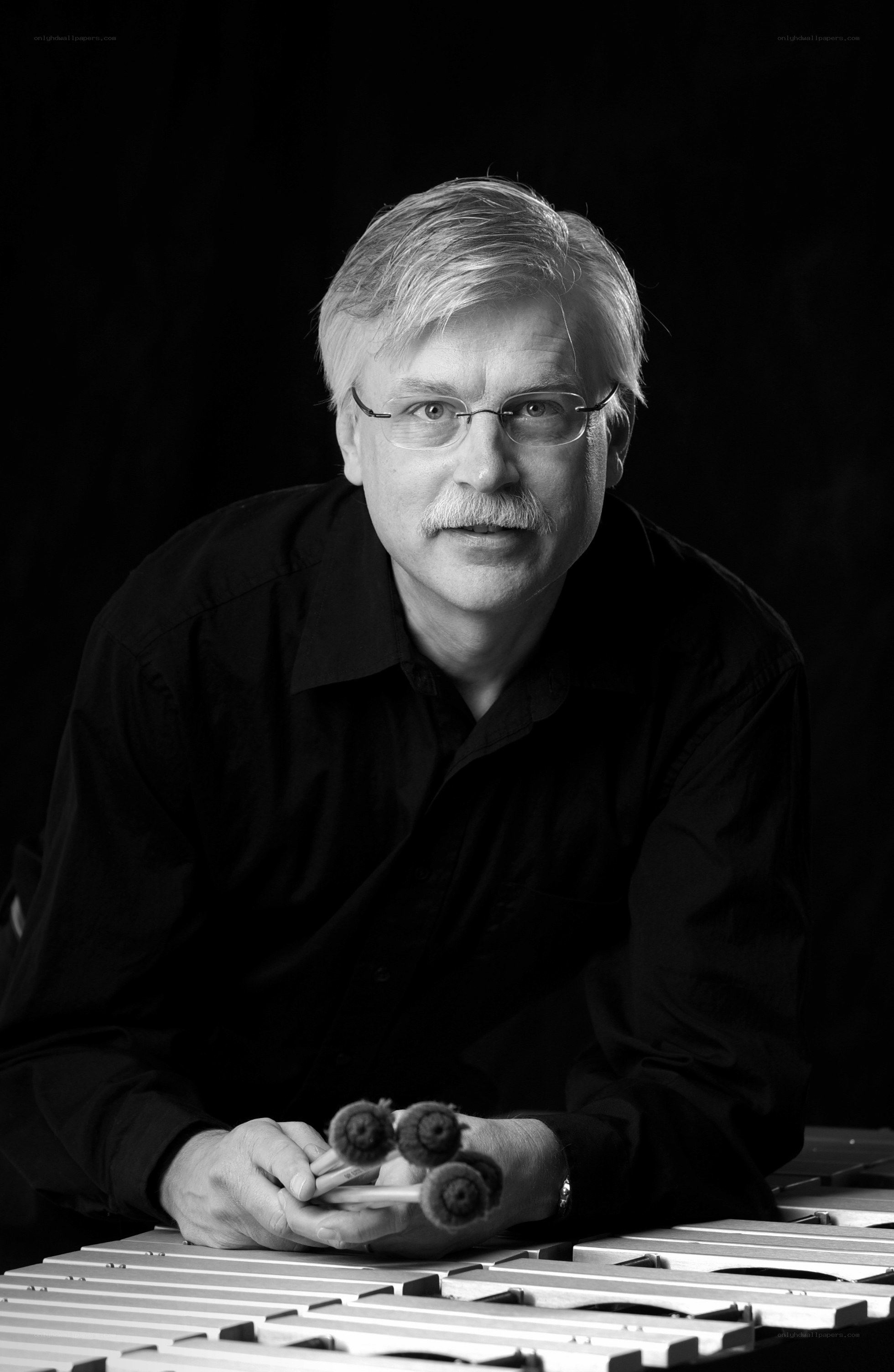 man with drumsticks and xylophone
