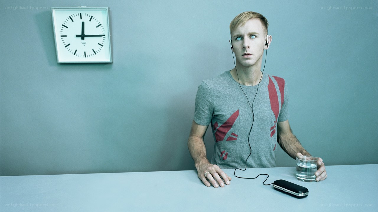man with earphones at table