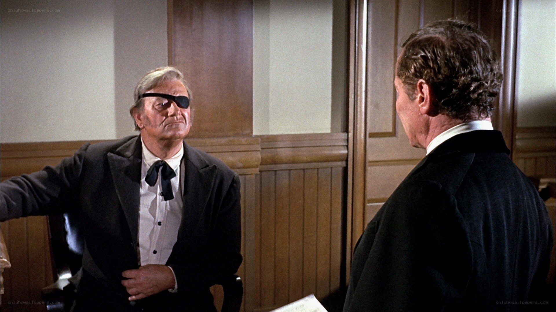 man with eye patch in courtroom