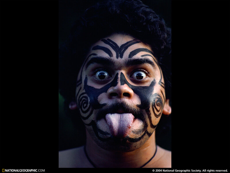 Man with face paint and tongue out