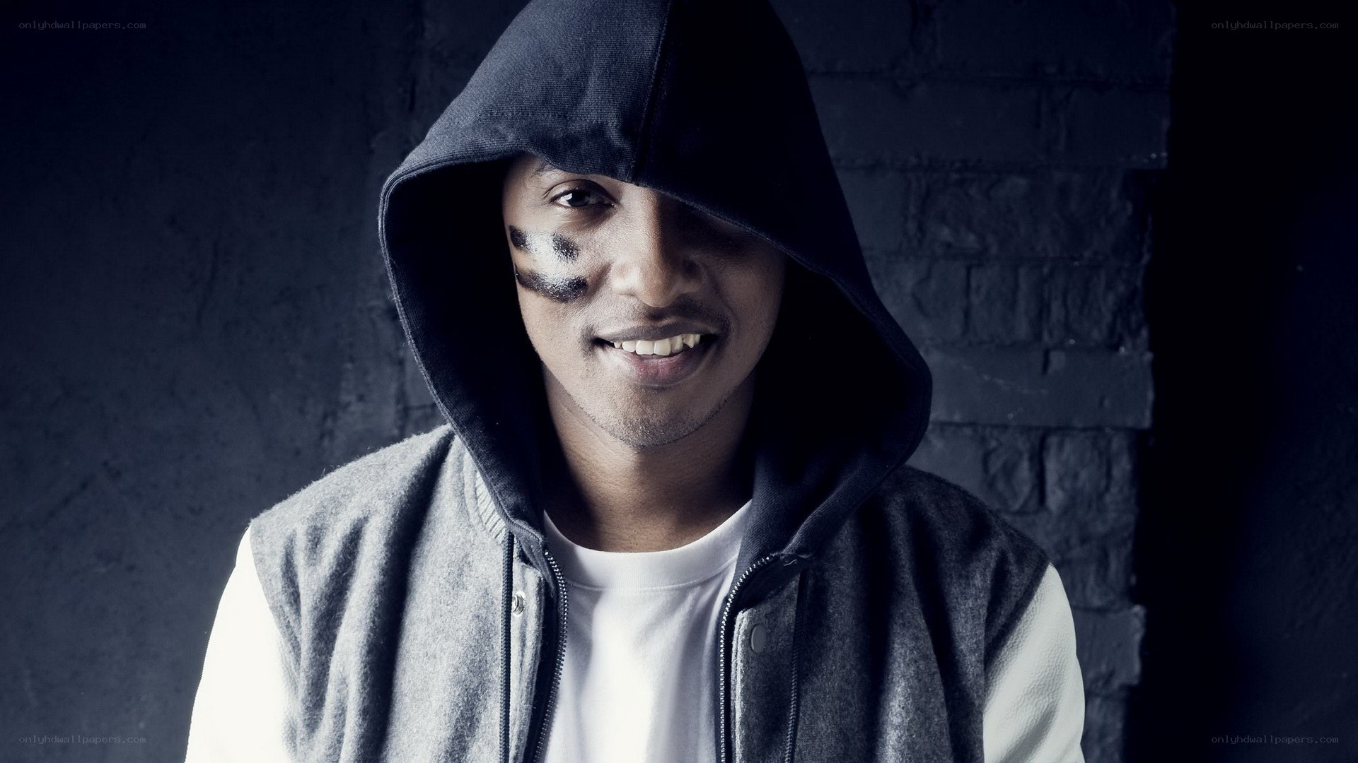 man with face paint in hoodie