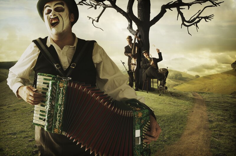 Man with Face Paint Playing Accordion