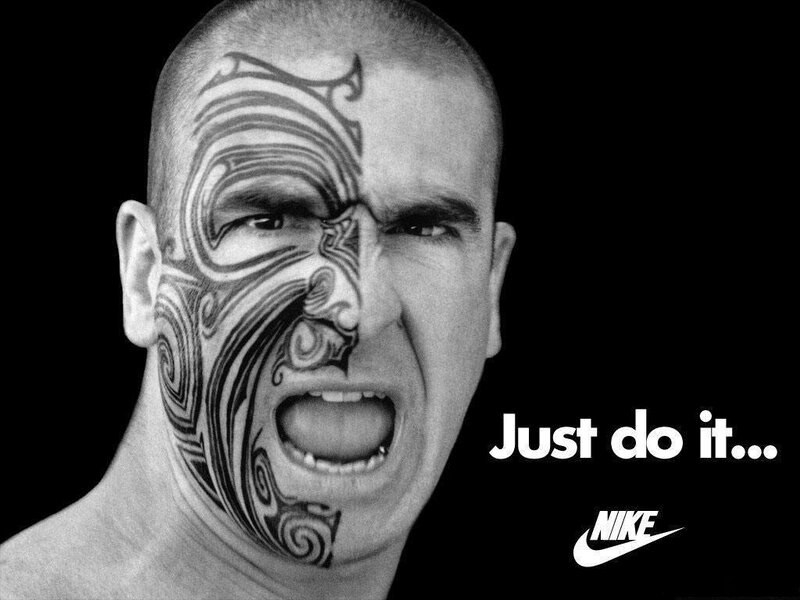 man with face tattoo shouting