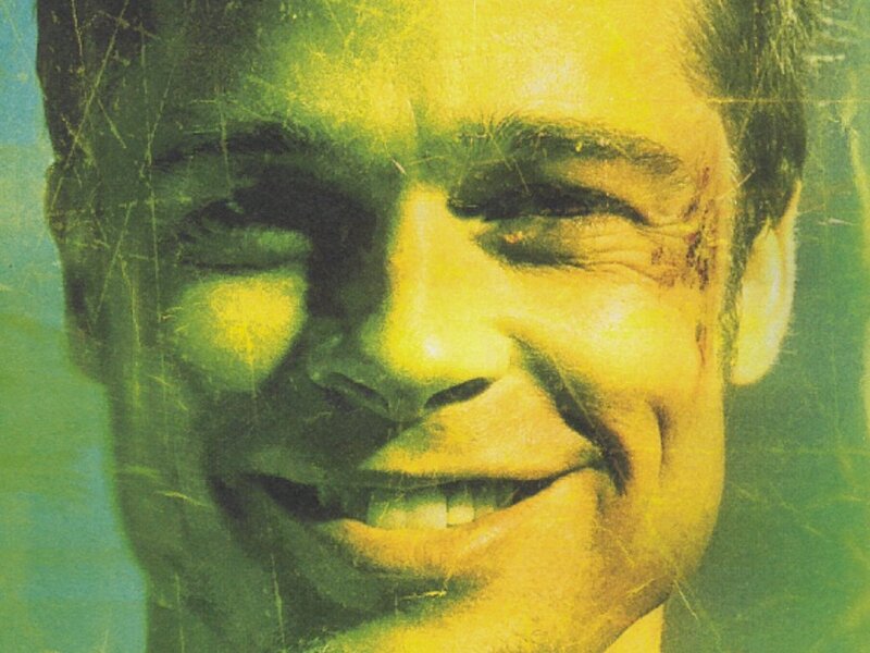 man with facial injury smiling