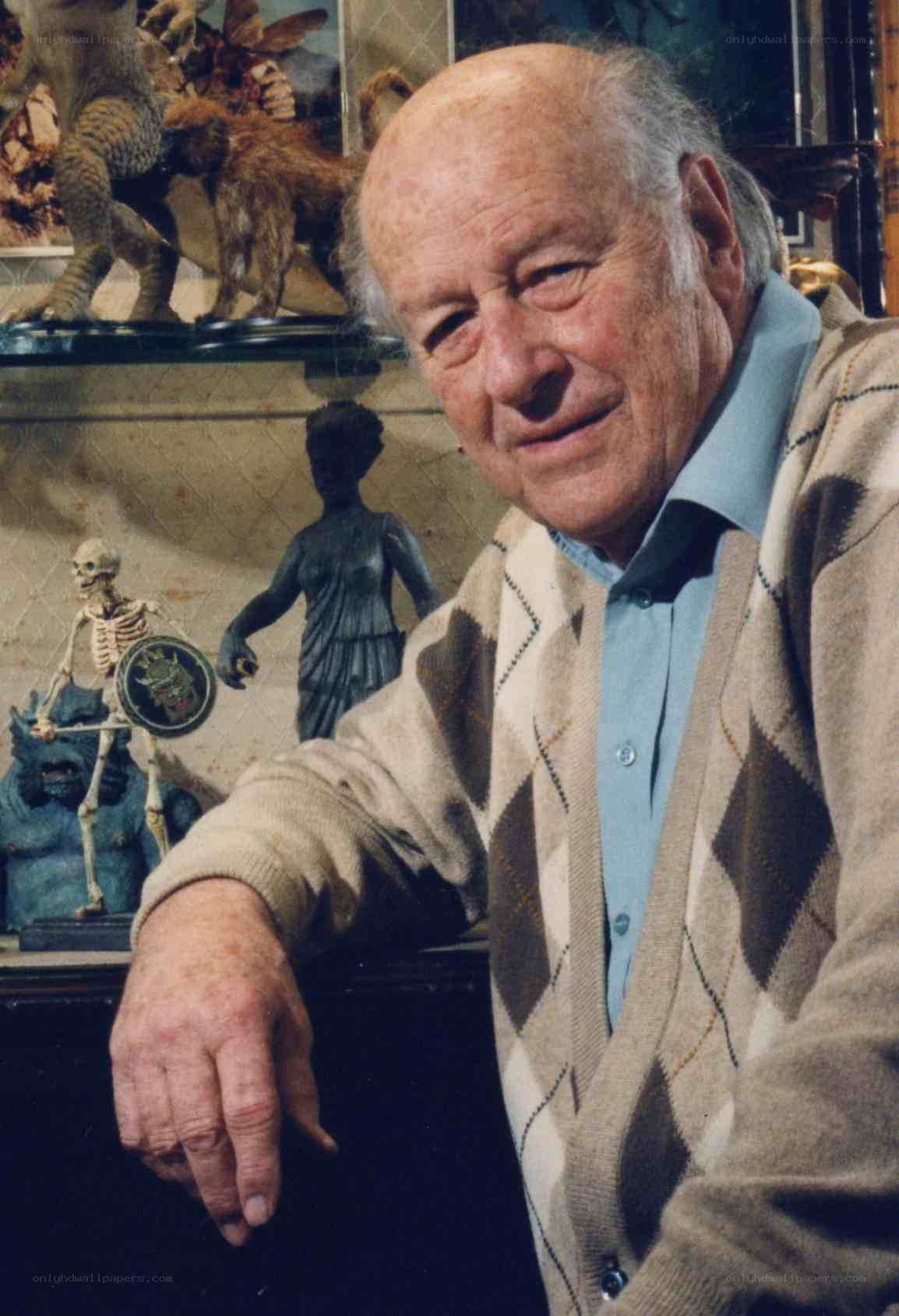 Man with figurines in background