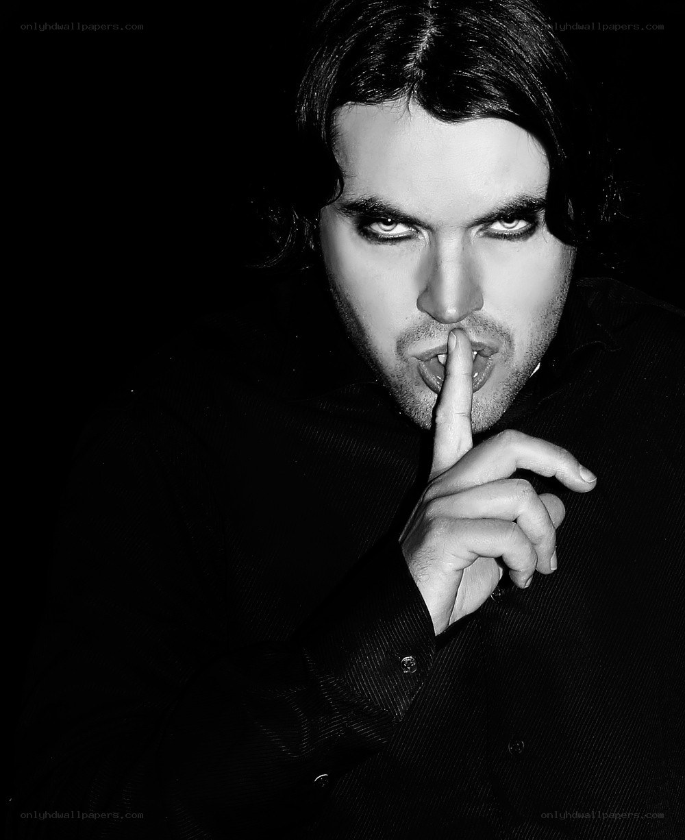 man with finger on lips