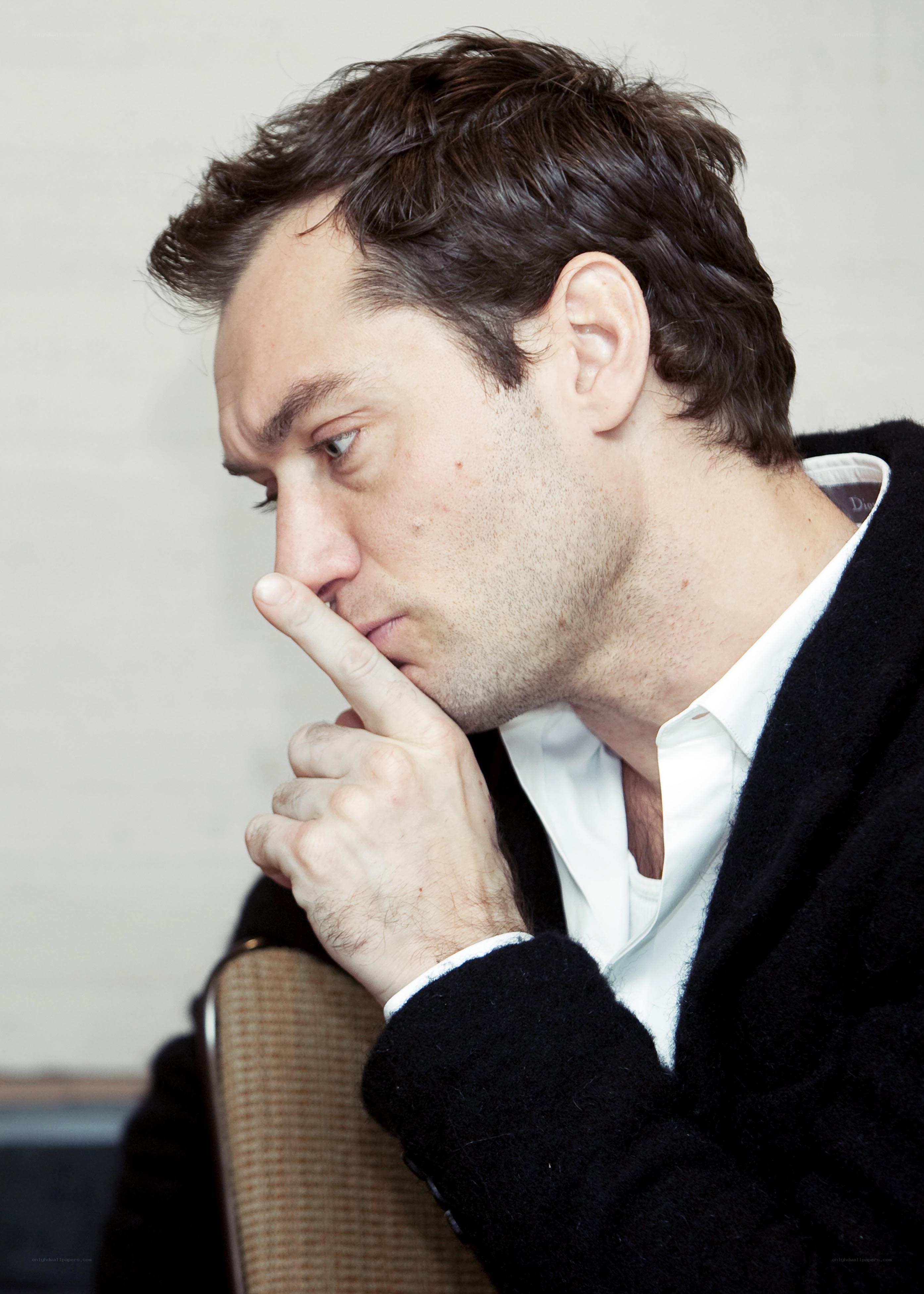 man with finger to chin
