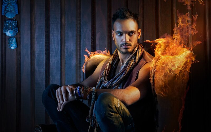 man with fire on chair