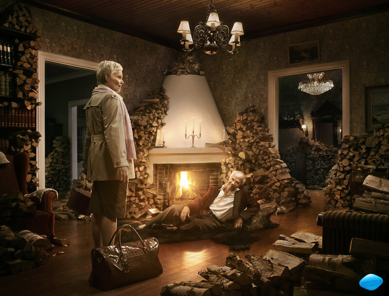 Man with firewood in living room
