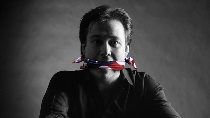 man with flag gagged