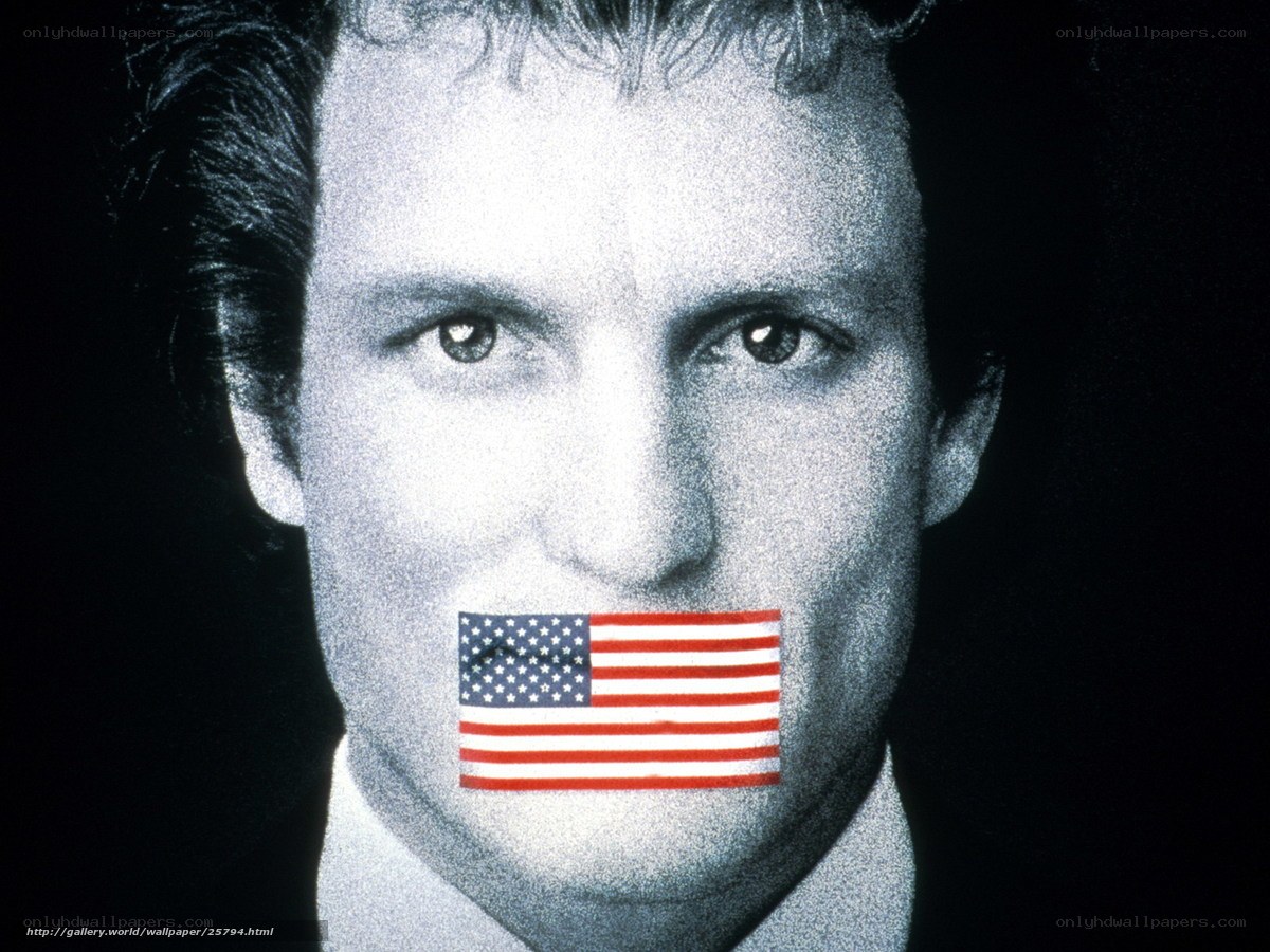 man with flag over mouth