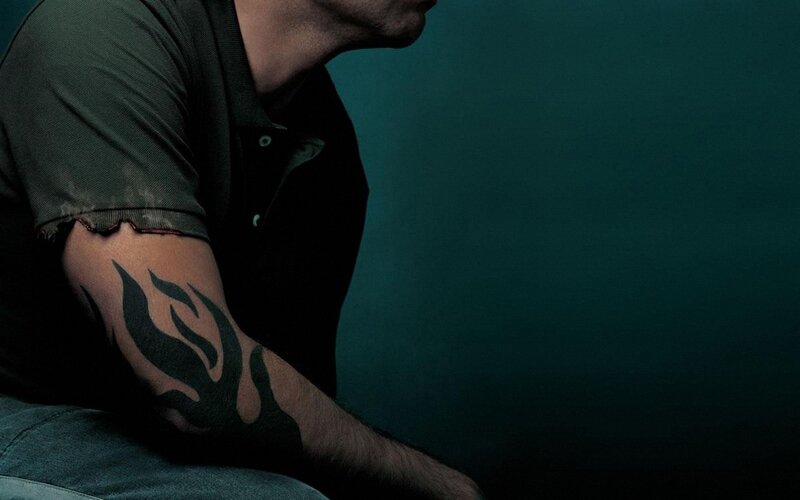 man with flame tattoo