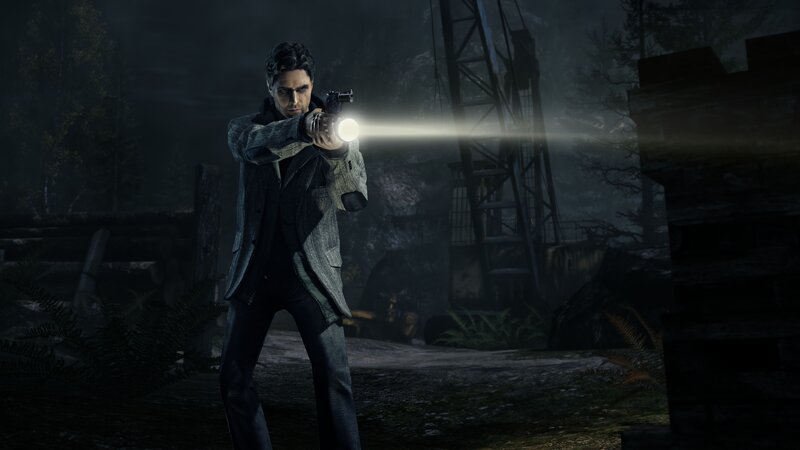 Man with flashlight in dark forest