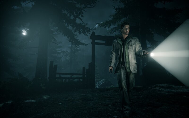 Man with flashlight in forest