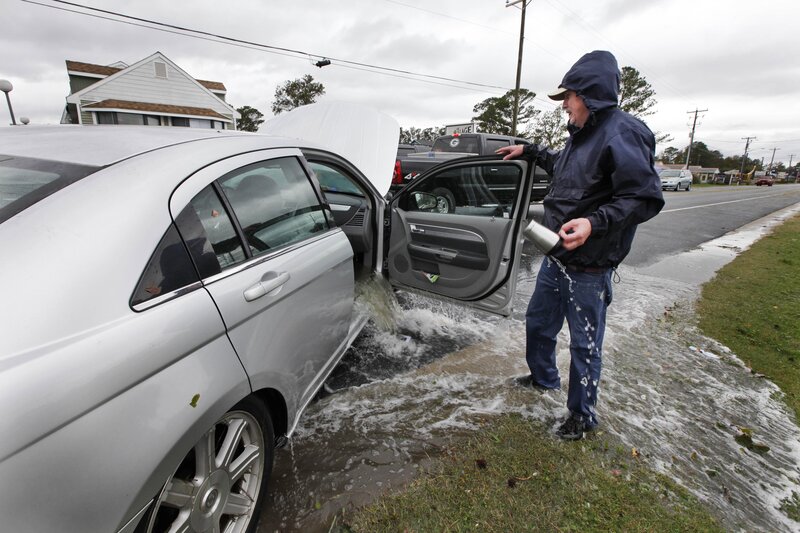 Man with flooded car