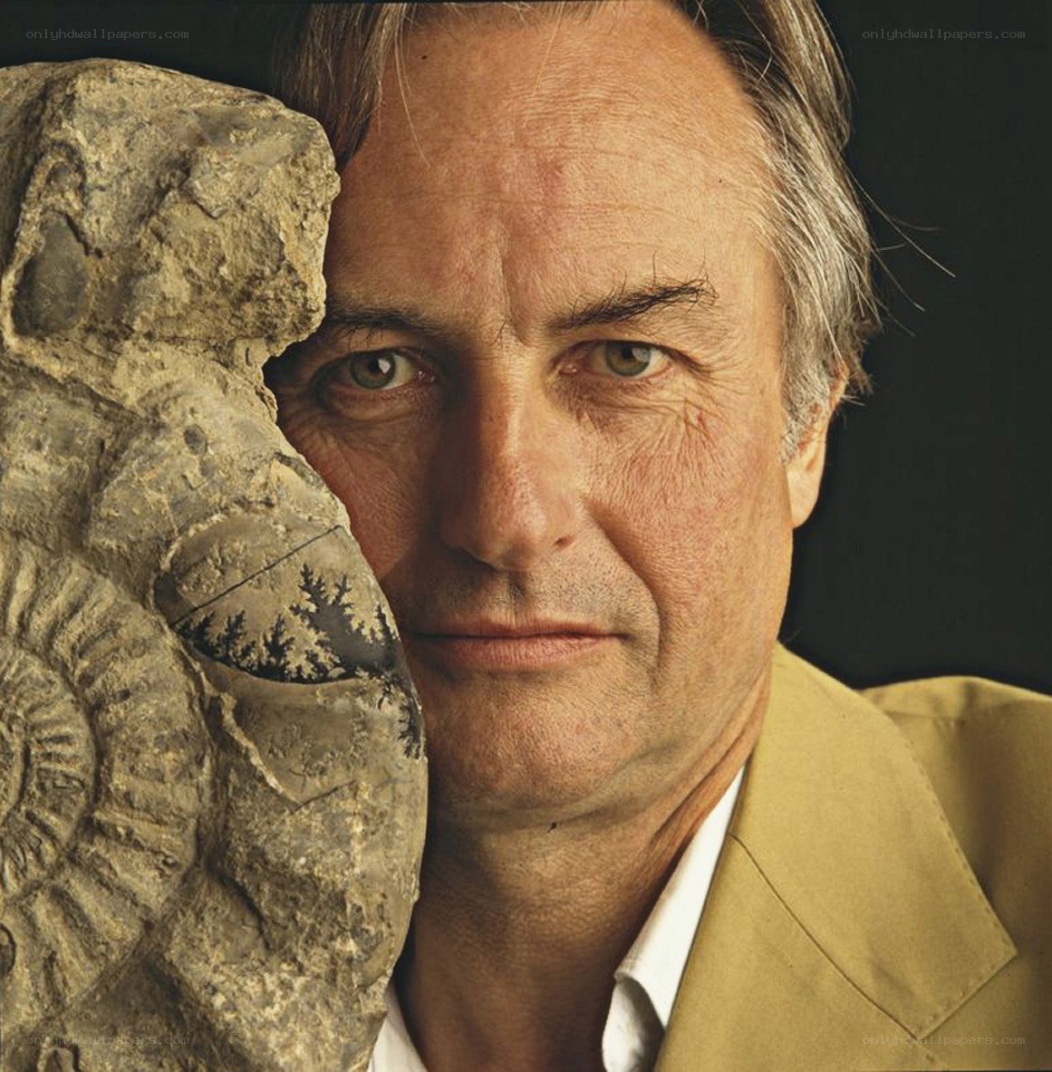 man with fossil specimen