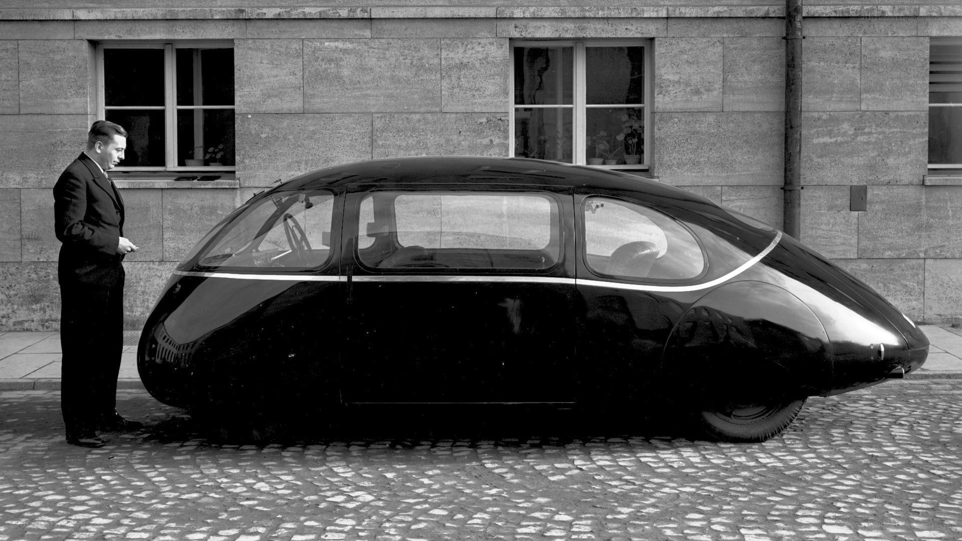 Man with futuristic car