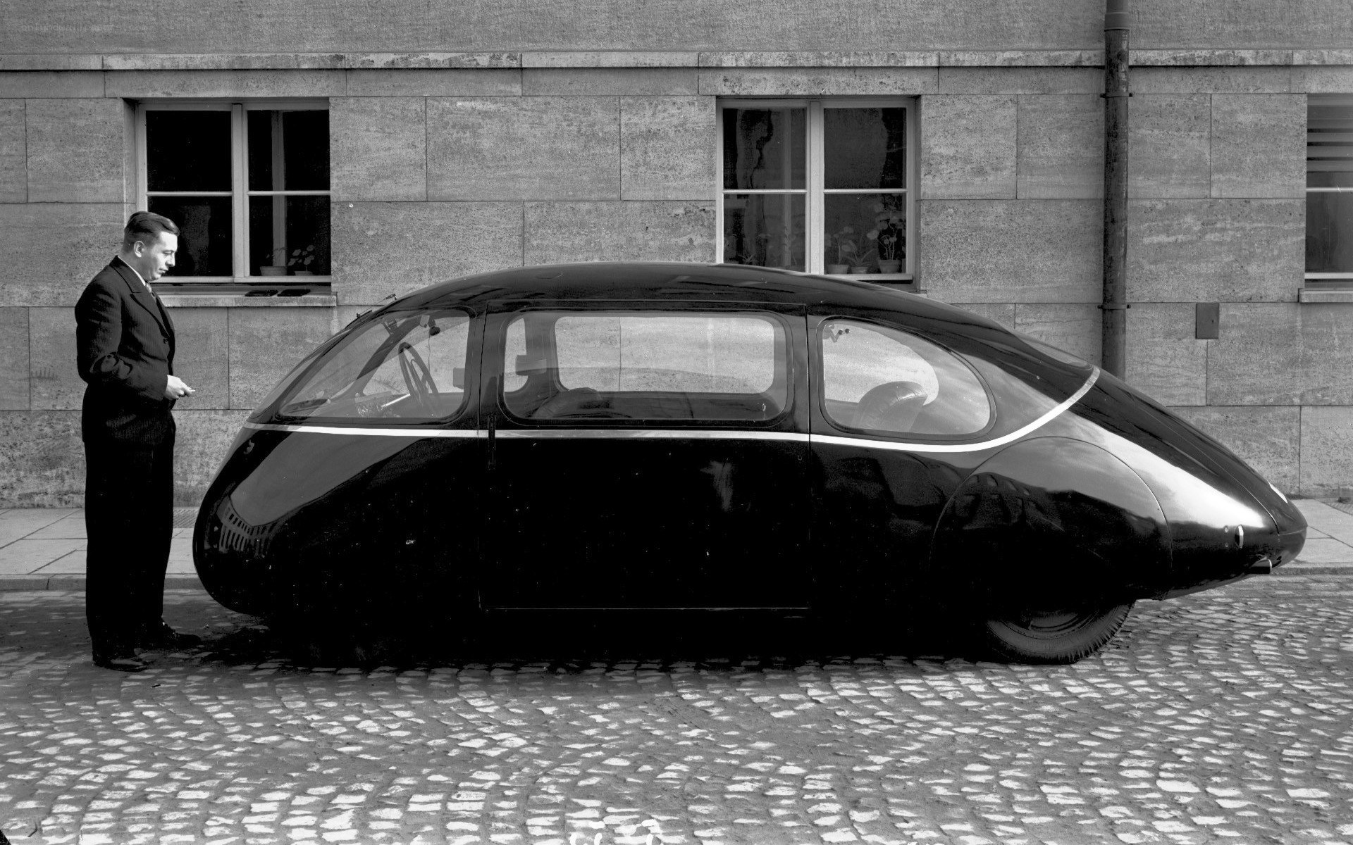 Man with futuristic car