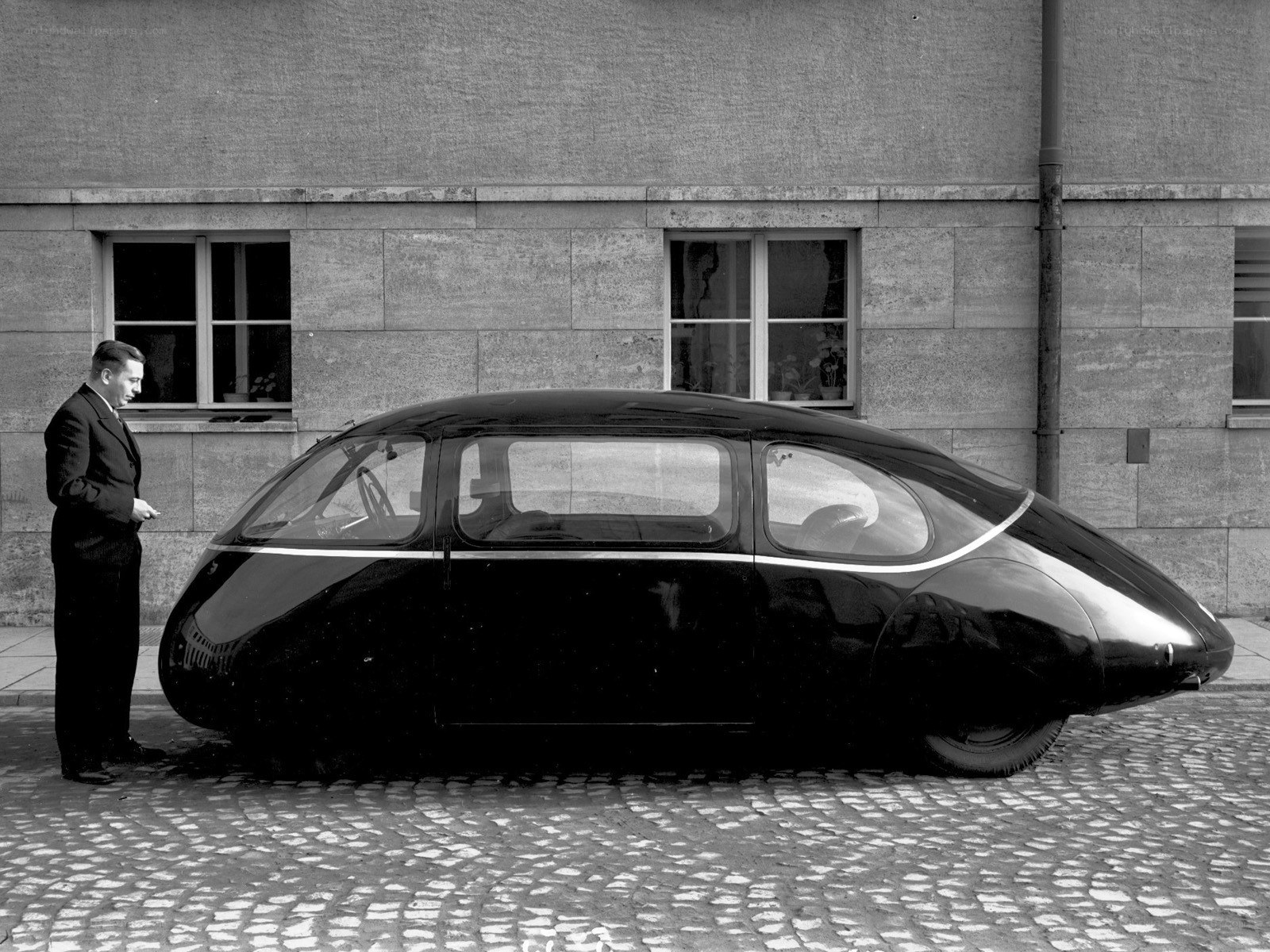 Man with futuristic car