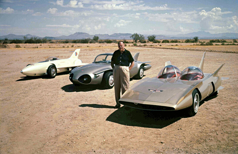 Man with futuristic cars