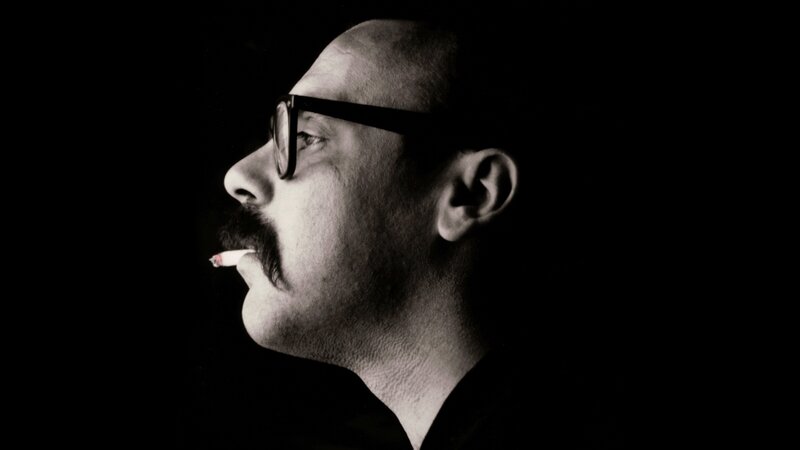 man with glasses and cigarette