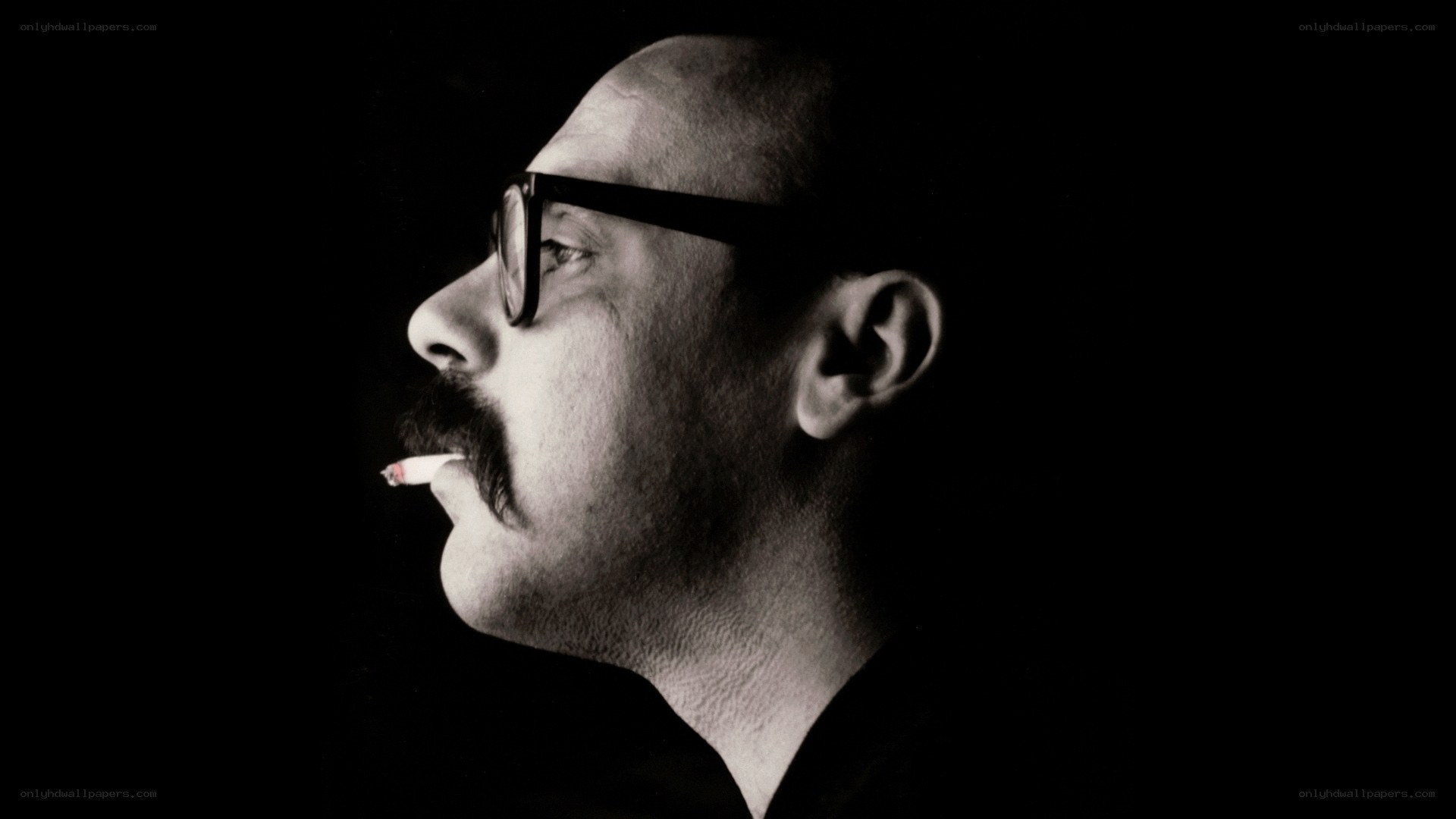 man with glasses and cigarette