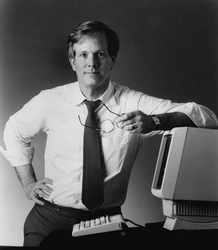 Man with glasses and computer