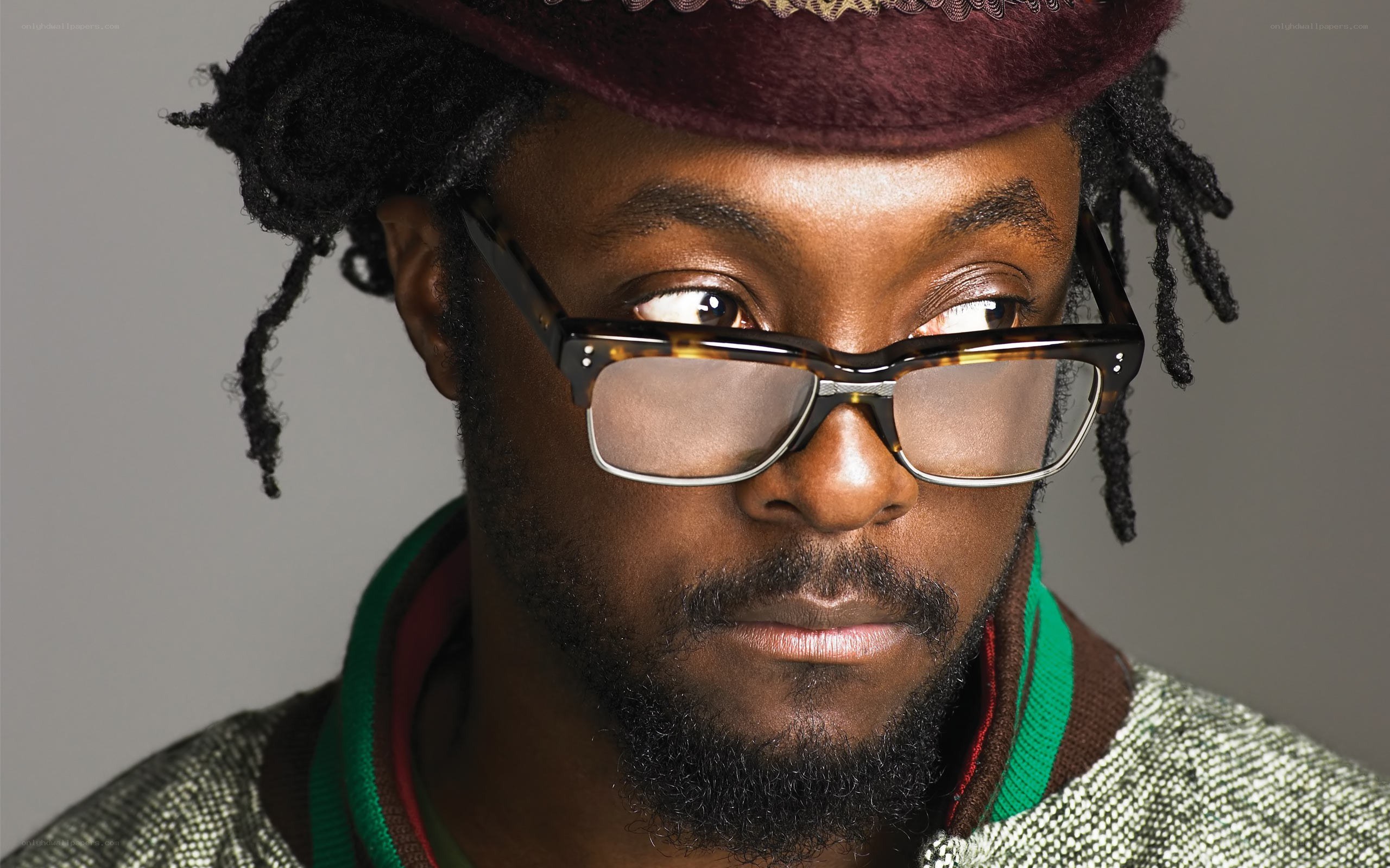 man with glasses and hat