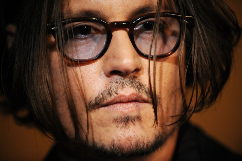 Man with Glasses and Long Hair — Brown, Serious