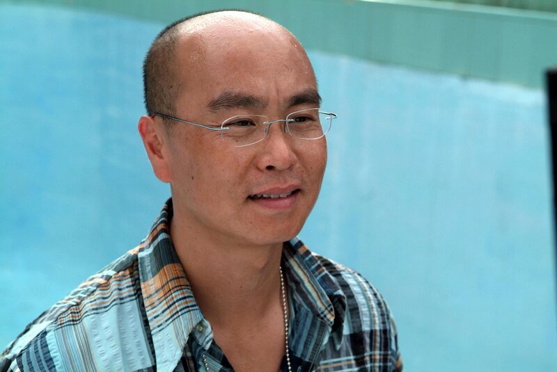 man with glasses and plaid shirt