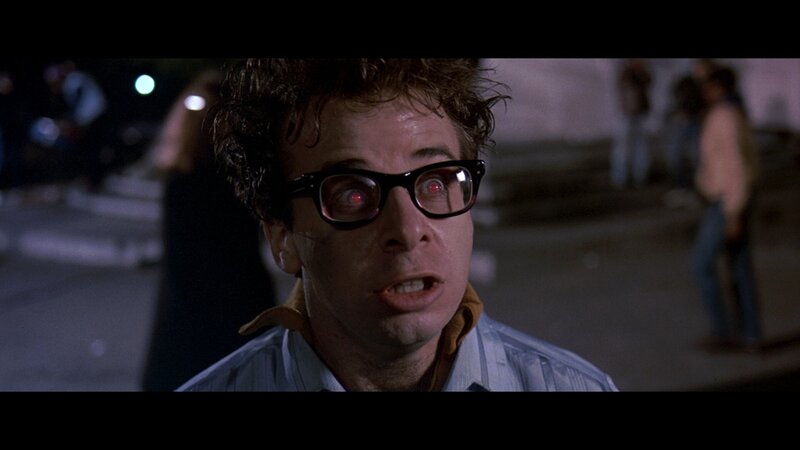 Man with Glasses and Red Eyes