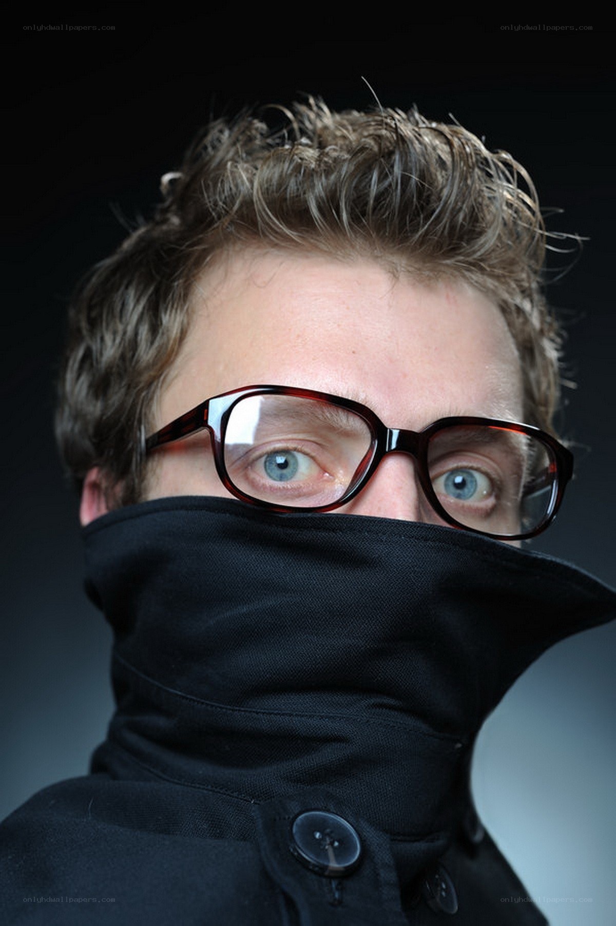 man with glasses and scarf