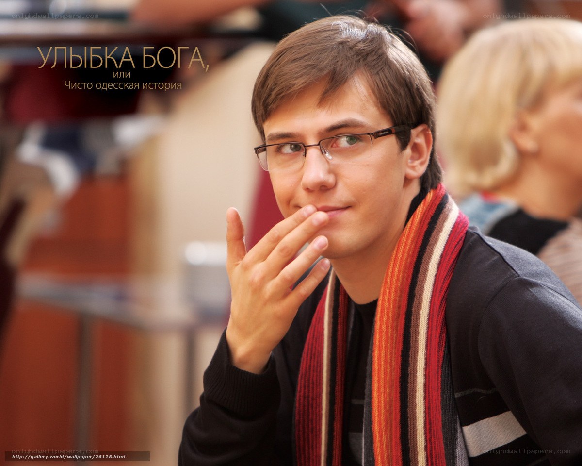 man with glasses and scarf