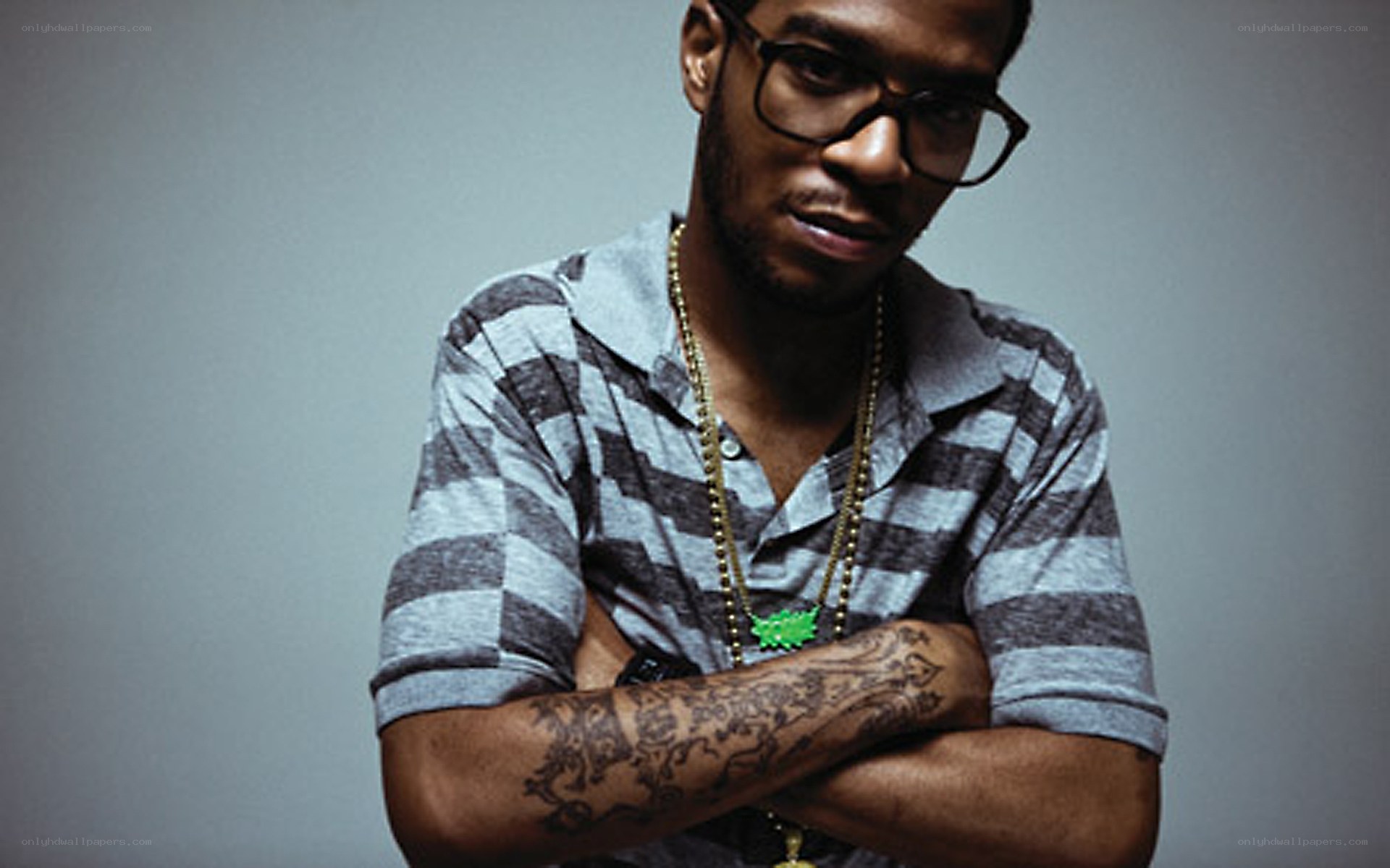 man with glasses and tattoos