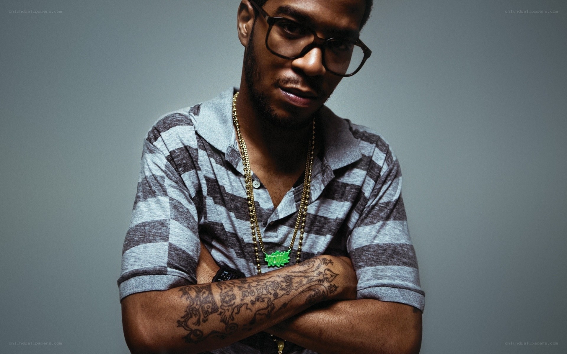 man with glasses and tattoos